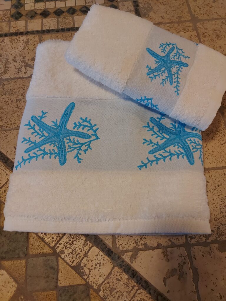SET ASCIUGAMANI IN SPUGNA  VISO E OSPITE STELLA TURCHESE